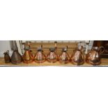 A collection of eight assorted copper flagons, largest 33cm, most of these are old Victorian