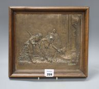 An early 20th century bronze plaque, cast in relief with Punchinello and signed Stella, 26 x 29cm,