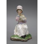 A 19th century Staffordshire figure of a seated young lady taking tea, height 13cm Condition: Good
