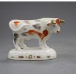 A Staffordshire porcelain figure of a standing bull, c.1830-40, fine crazing, both ears and horns