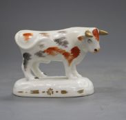 A Staffordshire porcelain figure of a standing bull, c.1830-40, fine crazing, both ears and horns