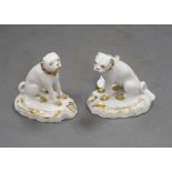 A pair of Derby gilt and white seated figures of pug dogs, c.1830, incised size '3', slight