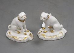 A pair of Derby gilt and white seated figures of pug dogs, c.1830, incised size '3', slight