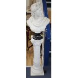 A composition faux marble bust of Apollo on a pedestal, overall H.128cm Condition: Surfaces