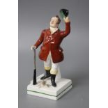 A 19th century Staffordshire figure of a huntsman with stoppered head and square base, height 17cm