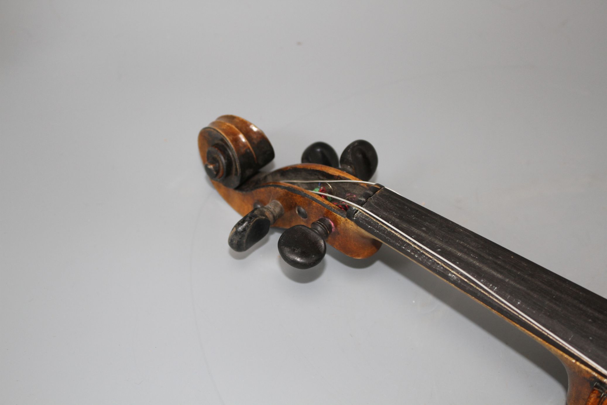 A violin with two piece back and bow, and a child's violin with bow, both with cases Condition:- - Image 27 of 44