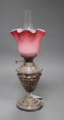 An Edwardian silver plated oil lamp by S. Hinks & Son of Birmingham, with coloured glass shade,