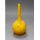 A Burmantofts yellow glazed vase, with impressed stylised floral decoration, monogrammed and