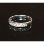 A modern 18ct white gold and seven stone diamond set half eternity ring, size L, gross weight 2.2