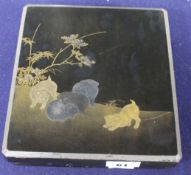 A Japanese Meiji lacquer writing box, the lid decorated with five puppies playing in a garden,