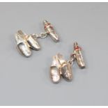 A pair of modern Asprey & Co silver and red enamel cufflinks, modelled as a pair of slippers,