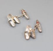 A pair of modern Asprey & Co silver and red enamel cufflinks, modelled as a pair of slippers,