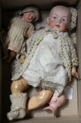 A Heubach character doll, intaglio eyes on shoulder plate broken, 18in., a Heubach character baby,