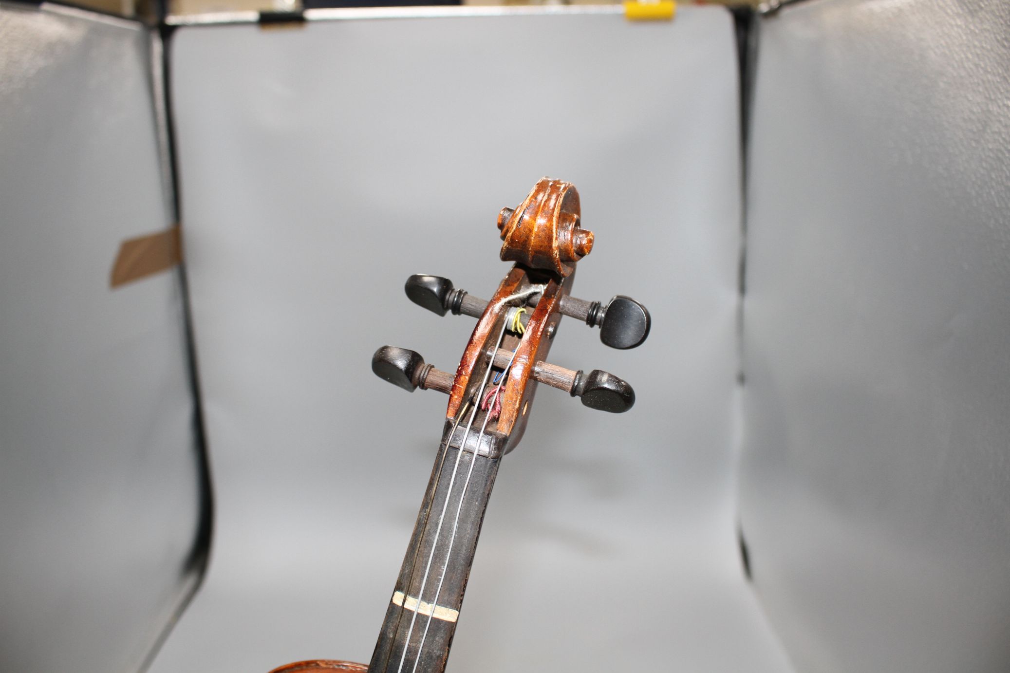 A violin with two piece back and bow, and a child's violin with bow, both with cases Condition:- - Image 42 of 44