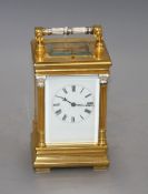 A 20th century silvered and gilt quarter repeating carriage clock, with enamelled Roman dial,