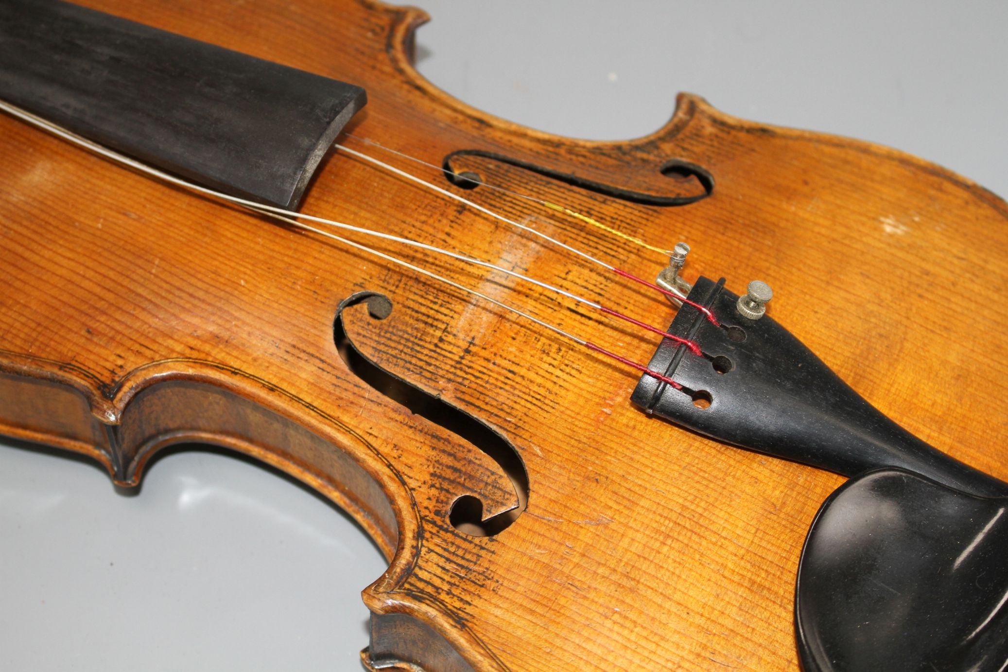 A violin with two piece back and bow, and a child's violin with bow, both with cases Condition:- - Image 28 of 44