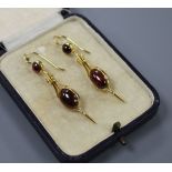 A pair of Victorian style yellow metal and cabochon garnet set drop earrings, overall 50mm, gross