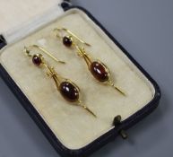 A pair of Victorian style yellow metal and cabochon garnet set drop earrings, overall 50mm, gross