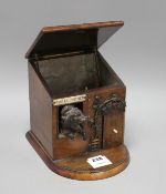 An early 20th century French novelty tobacco box, modelled as a porter's lodge, with a bronze dog in