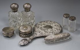 A late Victorian silver circular box and cover, a pair of similar silver mounted glass scent