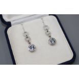 A modern pair of 18ct white gold, aquamarine and diamond set drop earrings, drop 29mm, gross