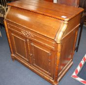 An Edwardian pine washstand, the rising top opening to reveal marble lined interior and mirror, over