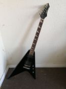 A Shine Offset Flying-V style electric guitar Condition: Electrics are working, tone pot crackles,