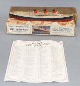 A boxed Chad Valley Unique Take to Pieces model of RMS Queen Mary, together with Keychart, marbled