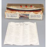 A boxed Chad Valley Unique Take to Pieces model of RMS Queen Mary, together with Keychart, marbled