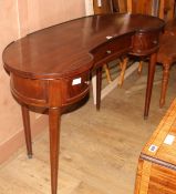 A mahogany kidney shaped dressing table, W.120cm D.50cm H.77cm Condition: The top has lost a piece