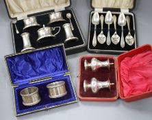 Four cased sets of silver, including pair of napkin rings, six grapefruit spoons, mounted