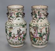 A pair of Chinese crackleware vases, decorated with figures in continuous landscapes, height 33cm