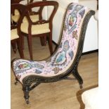 A late Victorian beadwork slipper chair, with polychrome beadwork upholstery Condition: Good