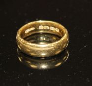 A George V 22ct gold wedding band, size N, weight 8.9 grams. Condition: Minor nicks and scratches.