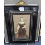 A group of assorted prints and photographs including an ebonised framed print of Princess Victoria