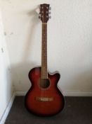 An Eagle Electro acoustic guitar Condition: Electrics are working, slight crackle to selectors, some