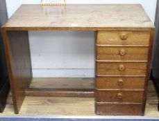 A Gordon Russell teak desk, with single tier of five drawers, W.107cm D.60cm H.77cm Condition: