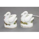 A pair of Staffordshire porcelain models of swans, c.1830-50, typical small manufacturing