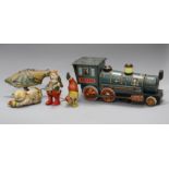 A clockwork cat and ball, and four assorted tinplate toys Condition:- cat and ball - felt rather
