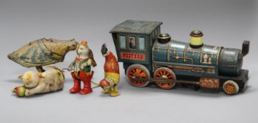 A clockwork cat and ball, and four assorted tinplate toys Condition:- cat and ball - felt rather