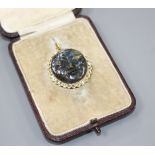 A 20th century yellow metal, diamond and carved labradorite? 'moon face' pendant, 26mm, gross weight
