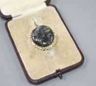 A 20th century yellow metal, diamond and carved labradorite? 'moon face' pendant, 26mm, gross weight