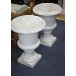 A pair of Meuble Francais campana shaped urns, H.62cm Condition: One of the bases has a small chip