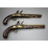 A pair of flintlock holster pistols by W. Ketland & Co, late 18th century, brass barrels 9" engraved