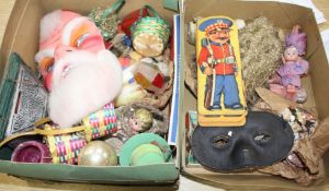 A collection of assorted curios, mostly vintage Christmas decorations but including masks and