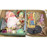 A collection of assorted curios, mostly vintage Christmas decorations but including masks and