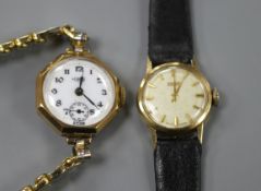 Two lady's gold manual wind wrist watches, Tissot 14ct and Hirco 9ct, on leather and gold plated