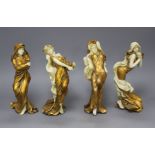 A set of four Italian gilt resin figures of maidens representing The Seasons, stamped STT, height