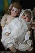 An AM 1894 doll, original body, 22in. and a Kopplesdorf doll, bent limbs, vintage original body,
