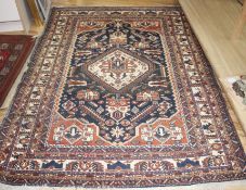 A Caucasian blue ground rug, 212 x 150cm